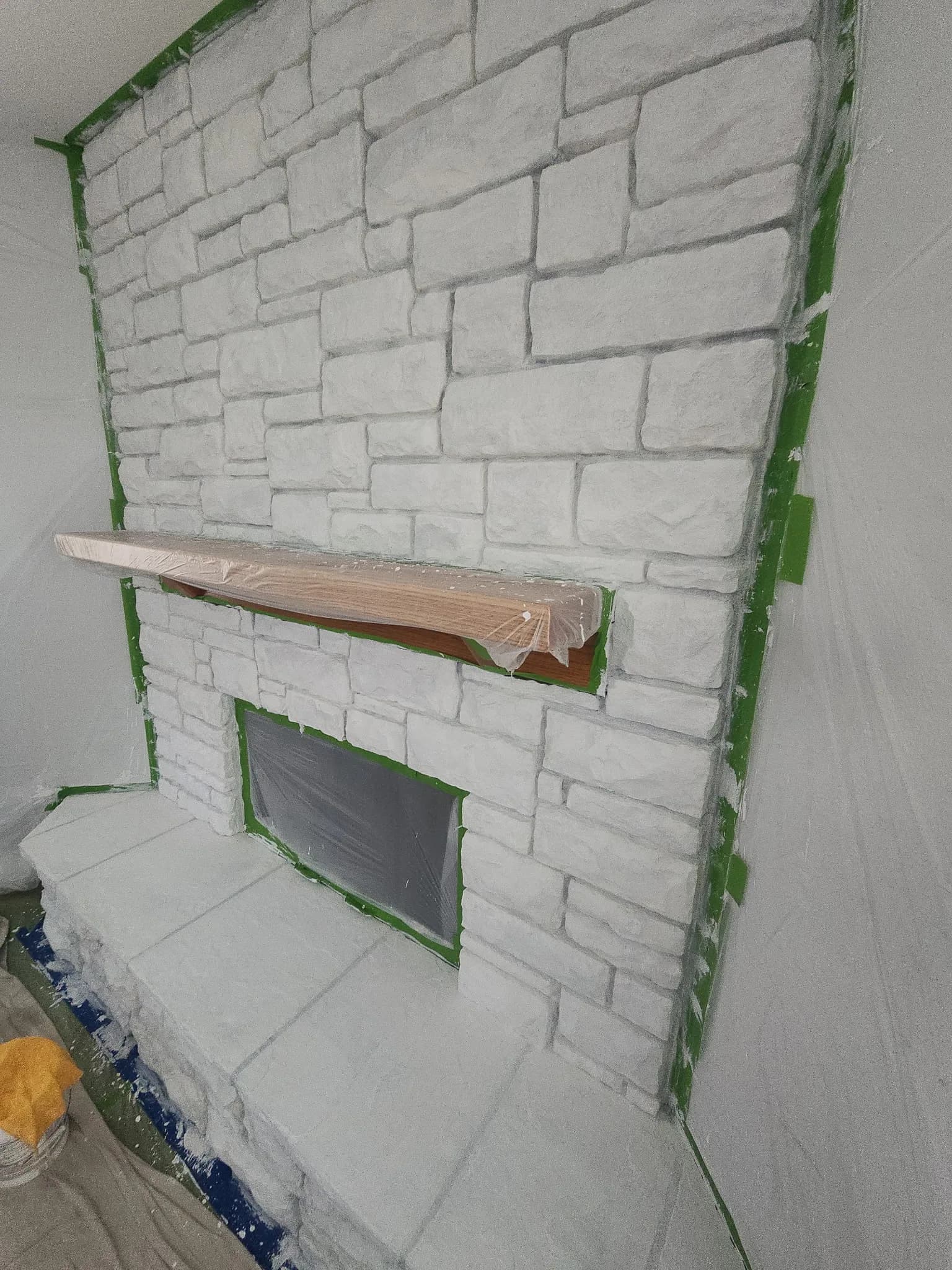 Painted stone feature fireplace, finished in white
